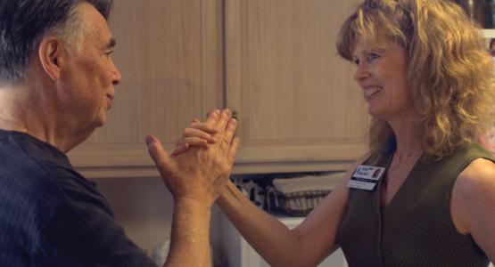 Occupational Therapist Diane Messer helps a patient with strengthening exercises during a visit to his home. Occupational Therapist Diane Messer helps a patient with strengthening exercises during a visit to his home.