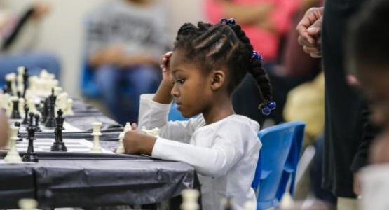 Nia Burton, BJA kindergartener, concentrates before she makes her next move at the chess tournament. Nia Burton, BJA kindergartener, concentrates before she makes her next move at the chess tournament.
