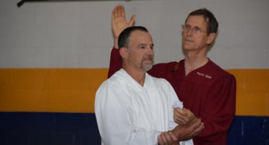 At this year's Pennyslvania Camp Meeting, Mark Dekle, pastor of the Walnutport church, baptizes Doug Seipt. At this year's Pennyslvania Camp Meeting, Mark Dekle, pastor of the Walnutport church, baptizes Doug Seipt.