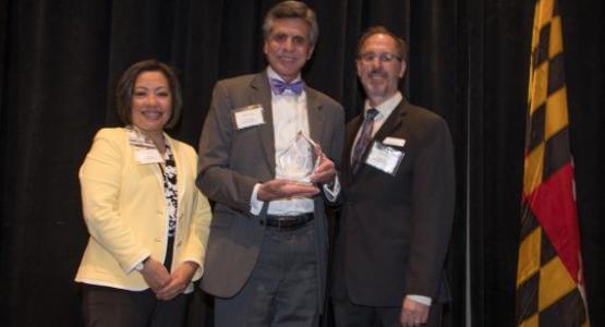 John Sackett, Executive Vice President and Chief Operating Officer for Adventist HealthCare, and Ann Roda, Vice President of Mission and Spiritual Care for Adventist HealthCare, accept the Interfaith Works 2019 Philanthropic Champion of the Year Award from CEO Shane Rock during an April breakfast. John Sackett, Executive Vice President and Chief Operating Officer for Adventist HealthCare, and Ann Roda, Vice President of Mission and Spiritual Care for Adventist HealthCare, accept the Interfaith Works 2019 Philanthropic Champion of the Year Award from CEO Shane Rock during an April breakfast.