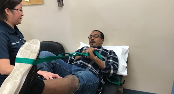 Lynda Hiponia, a physical therapist with Adventist HealthCare Rehabilitation, helps fire survivor Memar Ayalew regain strength and mobility in his leg. Lynda Hiponia, a physical therapist with Adventist HealthCare Rehabilitation, helps fire survivor Memar Ayalew regain strength and mobility in his leg.