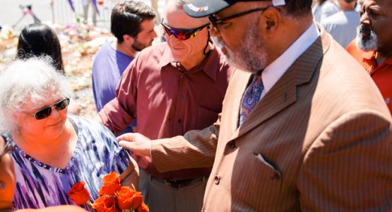 William Miller (center) and William T. Cox (right) comfort Susan Bro, mother of Heather Heyer, the 32-year-old woman who died after being struck by a car that plowed into a crowd protesting a white nationalist rally in her city. William Miller (center) and William T. Cox (right) comfort Susan Bro, mother of Heather Heyer, the 32-year-old woman who died after being struck by a car that plowed into a crowd protesting a white nationalist rally in her city.