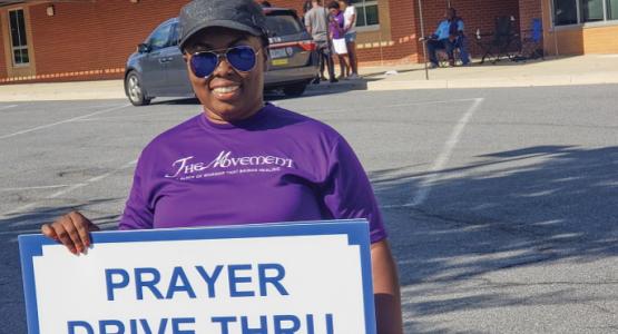 Church member and praise leader Ellen Boakye-Dankwa invites drivers for a quick prayer. Church member and praise leader Ellen Boakye-Dankwa invites drivers for a quick prayer.