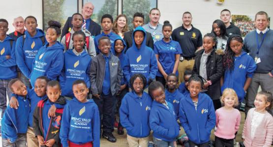 SVA’s Rwandan refugee students meet members of the police department who raised funds for their education. SVA’s Rwandan refugee students meet members of the police department who raised funds for their education.