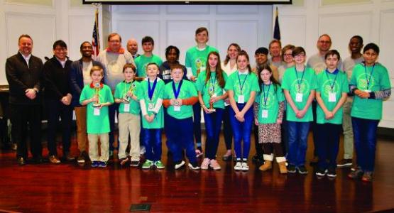 Education Superintendent Rick Bianco (far left) stands with the Geography Challenge emcee, winners, spon- sors and judges. Education Superintendent Rick Bianco (far left) stands with the Geography Challenge emcee, winners, spon- sors and judges.