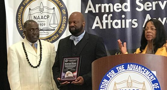 Richard Matthews (center) receives a NAACP award. Richard Matthews (center) receives a NAACP award.