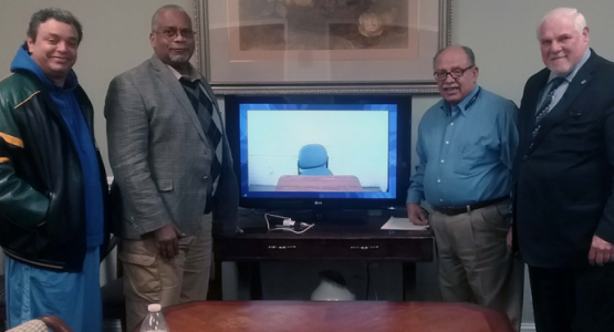 Potomac Conference Prison Ministries leaders Moises Escalera, Hispanic Affairs coordinator; Ryland Holmes, Family, Re-entry and Video Conferencing coordinator; Hector Cruz, senior coordinator; and John Carmouche, coordinator, stand in a video-conferencing room that allows families and inmates to communicate. Potomac Conference Prison Ministries leaders Moises Escalera, Hispanic Affairs coordinator; Ryland Holmes, Family, Re-entry and Video Conferencing coordinator; Hector Cruz, senior coordinator; and John Carmouche, coordinator, stand in a video-conferencing room that allows families and inmates to communicate.