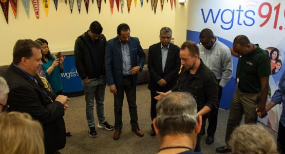 The WGTS team prays for Darren Mulligan of WAM before the event. The WGTS team prays for Darren Mulligan of WAM before the event.