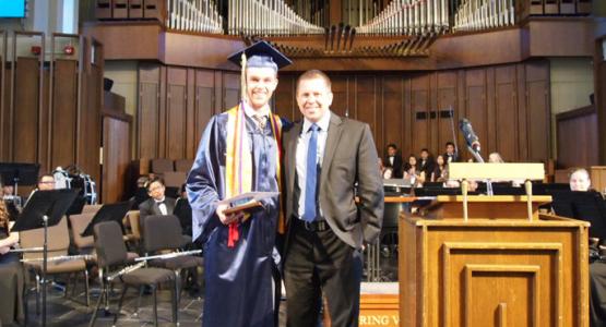Zachary Macomber and Darren Wilkins, Spring Valley Academy principal, after graduation Zachary Macomber and Darren Wilkins, Spring Valley Academy principal, after graduation