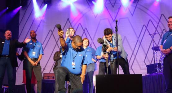 1. The WGTS 91.9 team records the audience singing the jingle. Left to right – PM Drive Host Johnny Stone; AM Drive Host Jerry Woods; Traffic anchor Tom Miner; PD Brennan Wimbish, Midday host Becky Alignay, Music Director Rob Conway; Video director Eugene Simonov and General manager Kevin Krueger. 1. The WGTS 91.9 team records the audience singing the jingle. Left to right – PM Drive Host Johnny Stone; AM Drive Host Jerry Woods; Traffic anchor Tom Miner; PD Brennan Wimbish, Midday host Becky Alignay, Music Director Rob Conway; Video director Eugene Simonov and General manager Kevin Krueger.