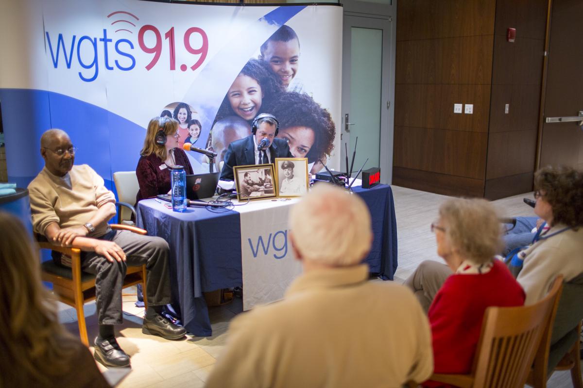 1.	Johnny Stone and Becky Alignay get ready to interview Sgt. 1st Class Theodore Wilson in front of a studio audience in the “Hall of Honors” at the Armed Forces Retirement Home in D.C.