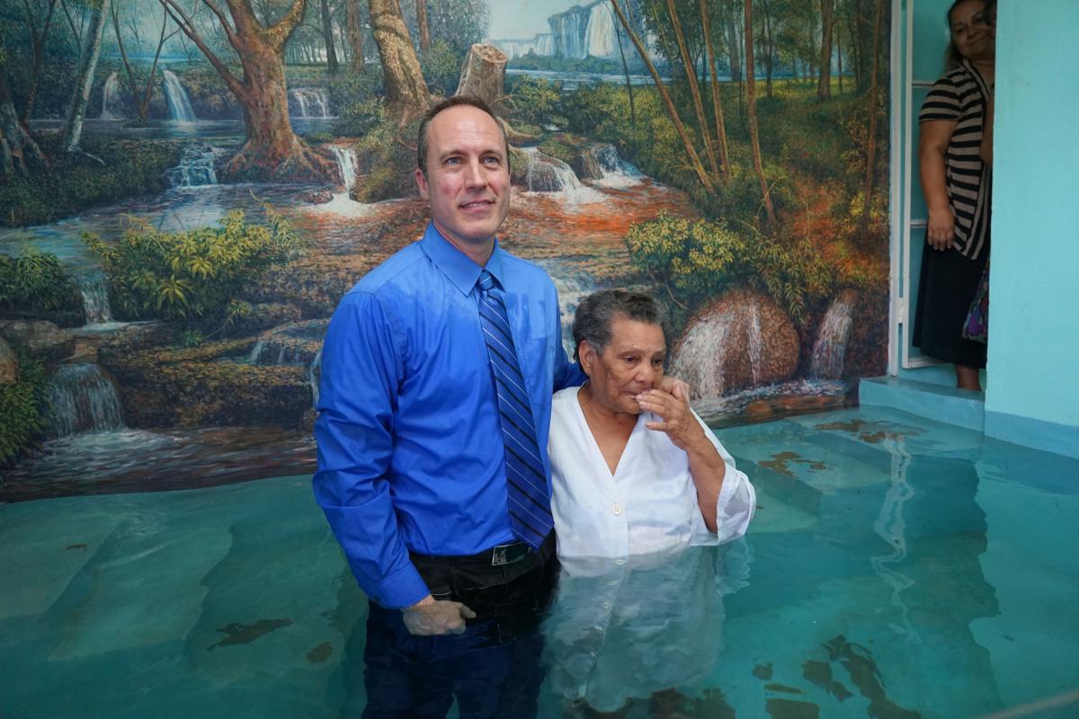 David Klinedinst, evangelism director and trip coordinator, baptizes a woman who attended the weeklong series.