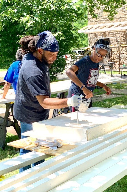 Pine Forge Academy’s Music Director Jarrett Roseborough and science instructor Kohren Joseph (’10) remodel and paint North Hall.