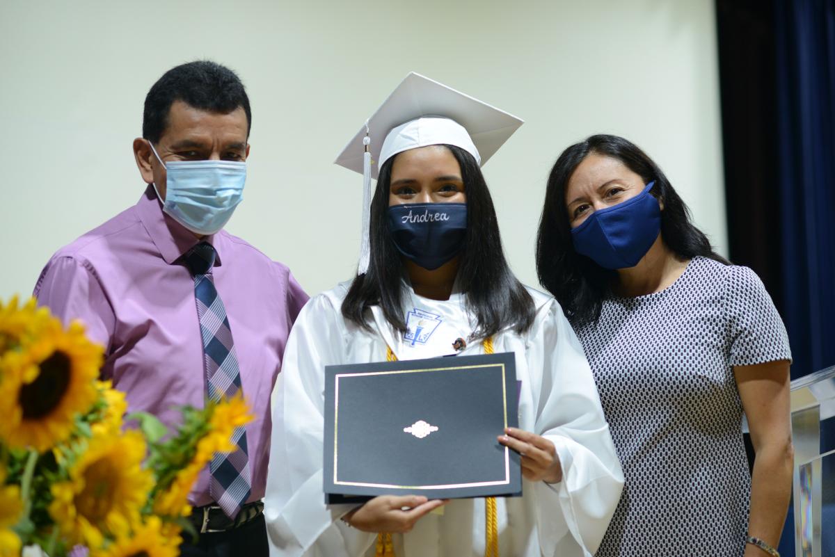 Andrea Huaytalla is pictured with her parents Edgard and Elizabeth