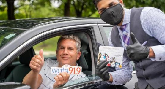 A WGTS listener drops off food and chats with Community Engagement Director, Jitesh Ram. A WGTS listener drops off food and chats with Community Engagement Director, Jitesh Ram.