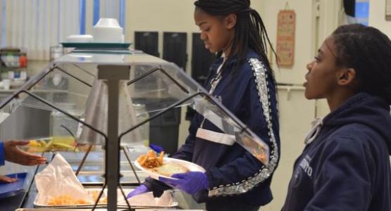 Junior Sh’Dai Forrester and freshman Miya Fields serve food in the cafeteria. Junior Sh’Dai Forrester and freshman Miya Fields serve food in the cafeteria.
