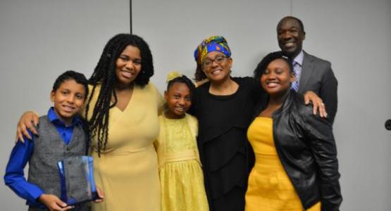 Maxine Forbes-Goulding and her former and current students and Sadrail Saint-Ulysse celebrate Forbes-Goulding's recent honor. Maxine Forbes-Goulding and her former and current students and Sadrail Saint-Ulysse celebrate Forbes-Goulding's recent honor.