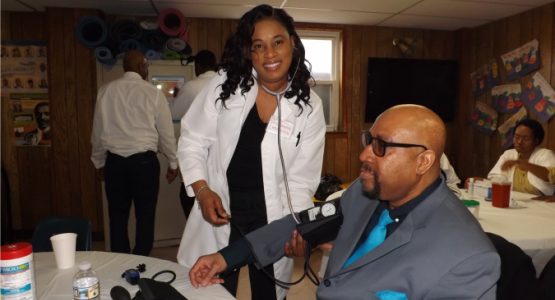 Willow Grove church member Rosemarie Webster takes blood pressure from frequent visitor Dornell LaVant during the Community Outreach Day. Willow Grove church member Rosemarie Webster takes blood pressure from frequent visitor Dornell LaVant during the Community Outreach Day.